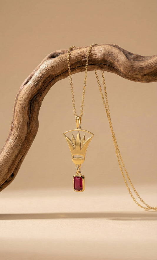 Gold lotus necklace with red stone pendant