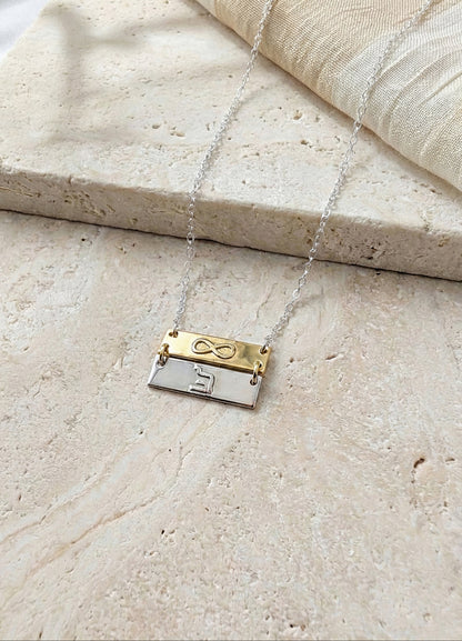 double bar necklace on beige stone bakground