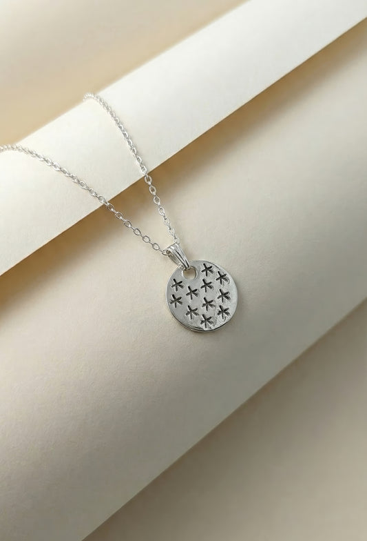 Sterling silver Egyptian stars necklace on white display