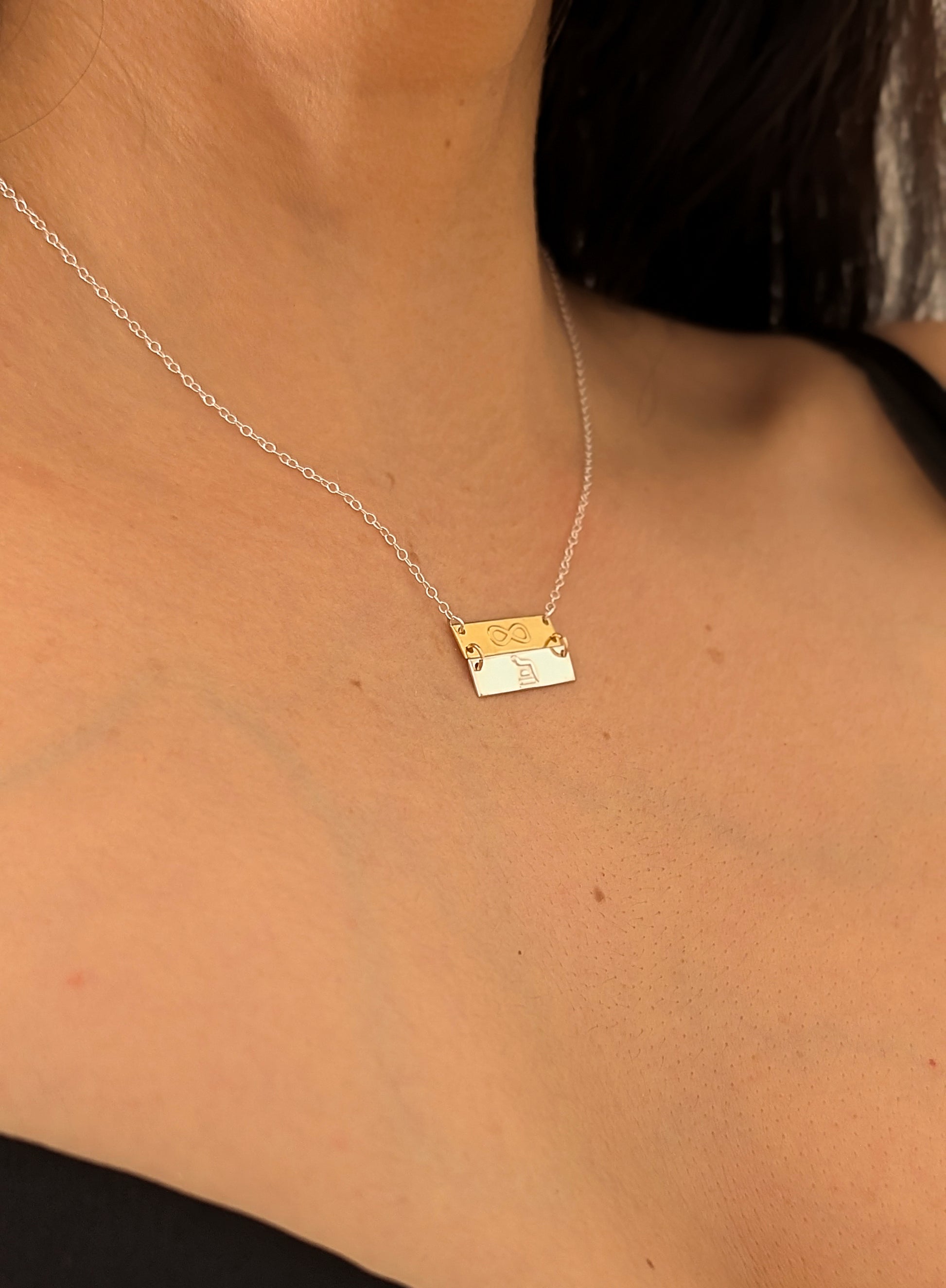 double fab necklace worn by woman
