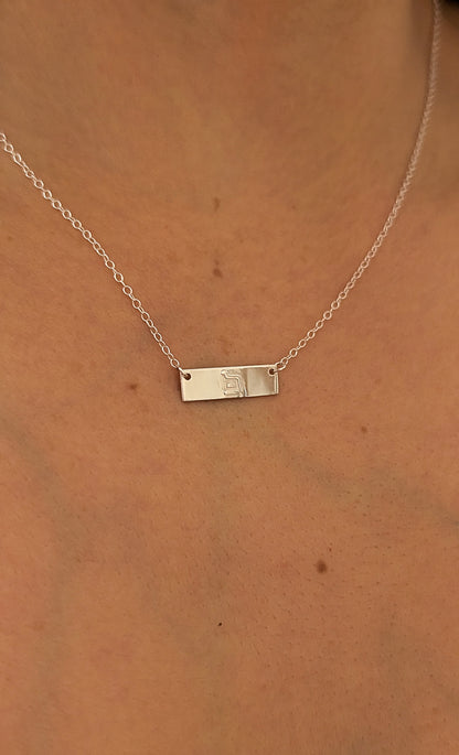 close up of eternity necklace on woman