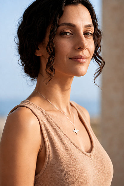 falcon necklace worn by woman