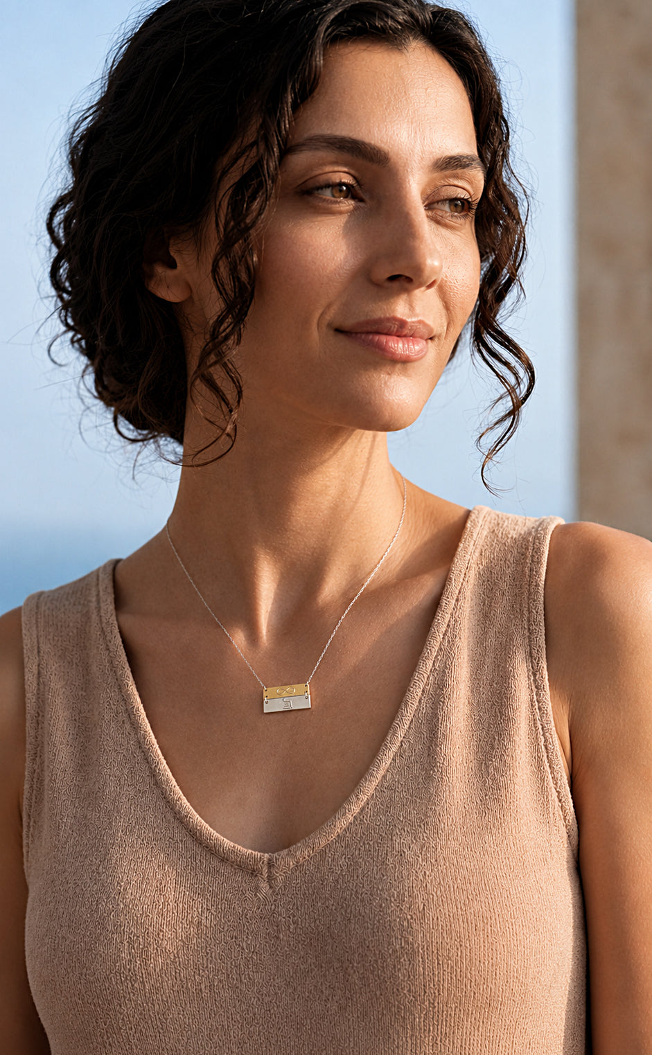 infinity eternity bar necklace worn by woman