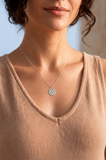 silver stars pendant necklace worn by woman